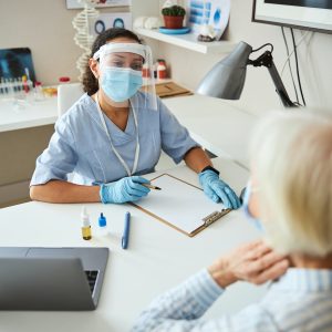 Attentive medical specialist listening to person complaints