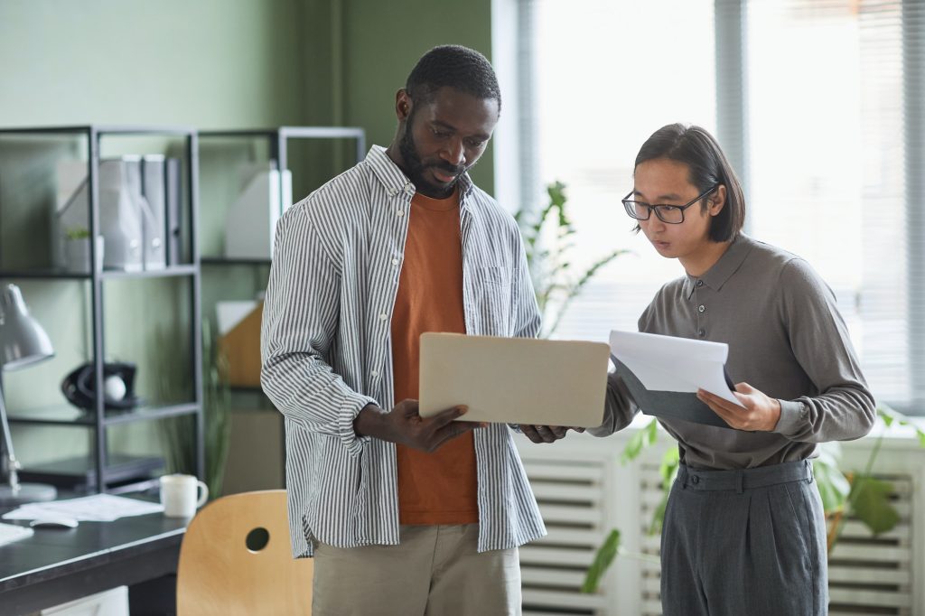 Two People Consulting in Office